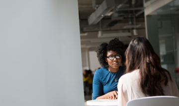 Women talking together at table